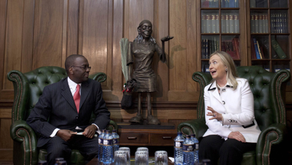 Secretary of State Hillary Clinton (R) speaks with Chief Justice Willy Mutunga at the Supreme Court of Kenya, in Nairobi, Kenya, August 4, 2012.