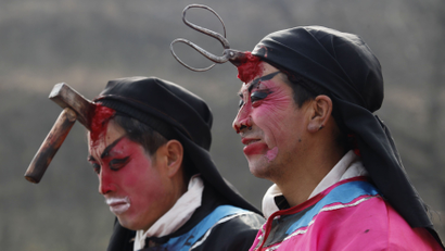 Local performers are dressed as villains injured by an axe and a pair of scissors during a traditional "Kuaihuo" parade at Chisha, Shaanxi province February 8, 2009. "Kuaihuo" is a local traditional performance which originated from an ancient story about chastising villains and has been performed for over 200 years to warn people to be behave well. REUTERS/Reinhard Krause