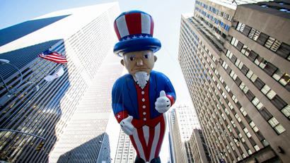 An Uncle Sam balloon floats down Sixth Avenue during the 87th Macy's Thanksgiving Day Parade in New York November 28, 2013.