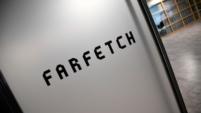 FILE PHOTO: Branding for online fashion house Farfetch is seen at the company headquarters in London, Britain January 31, 2018. REUTERS/Toby Melville/File Photo - RC123A8191A0