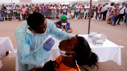 An audience member is swabbed for covid-19 at Yaounde's Olembe Stadium, ahead of the Africa Cup of Nations opening ceremony.