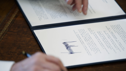 The signature of President Donald Trump is seen on an executive order in Oval Office of the White House.