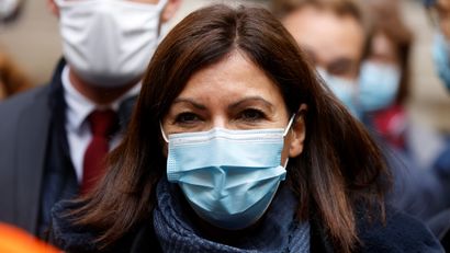 Paris mayor Anne Hidalgo looks on while wearing a mask