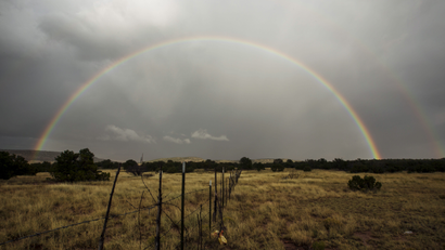 A rainbow forms after a passing rain shower near Grants, New Mexico