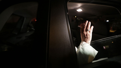 Pope Francis waves as he leaves Guanabara Palace where he attended a welcoming ceremony in Rio de Janeiro, July 22, 2013. Pope Francis touched down in Rio de Janeiro on Monday, starting his first foreign trip as pontiff and a weeklong series of events expected to attract more than a million people to a gathering of young faithful in Brazil, home to the world's largest Roman Catholic population.