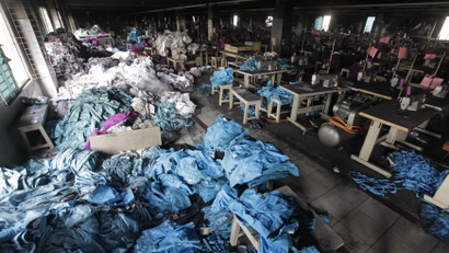 Piles of clothes in a sweatshop in Bangladesh