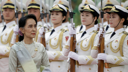 Myanmar State Counselor Aung San Suu Kyi reviews honour guards during a welcoming ceremony at the Great Hall of the People in Beijing, China, August 18, 2016. REUTERS/Jason Lee - S1AETWCTVVAA