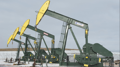 Pumpjacks taken out of production temporarily stand idle at a Hess site while new wells are fracked near Williston, North Dakota November 12, 2014.