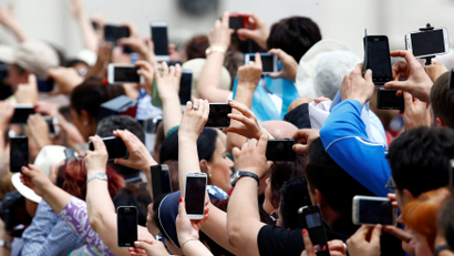 Crowd with phones at the Vatican
