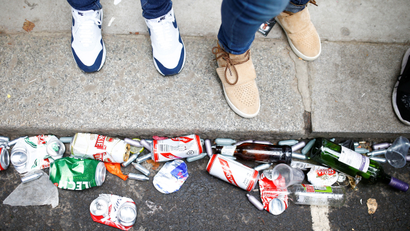 Empty canisters and beer cans can be seen on the ground during the Notting Hill Carnival in London.