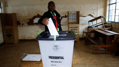 A man casts his vote inside a polling station during a presidential election re-run in Nairobi, Kenya October 26, 2017.