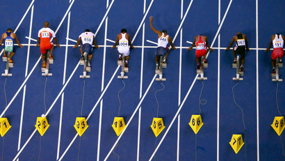 Competitors line before the start of the men's 100 metre race at the Pan American Games in Rio de Janeiro.
