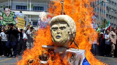 In this Friday, June 8, 2018, photo, an effigy of the U.S. President Donald Trump is set on fire during the annual anti-Israeli Al-Quds, Jerusalem, Day rally in Tehran, Iran. For Iran, the so-called “Axis of Evil” has become a lonely party of one as President Donald Trump prepares for direct talks with North Korea. With Saddam Hussein overthrown and Kim Jong Un now preparing for planned meeting in Singapore with Trump, Iran remains the last renegade among former President George W. Bush’s grouping of nations opposed to the U.S. It also comes after Trump pulled out of the nuclear deal, worsening Iran’s already-anemic economy.