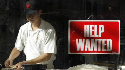 man with help wanted sign