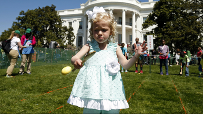 Ella Jane Michael, 4, from Fishersville, VA, takes part in the 136th annual Easter Egg Roll on the South...