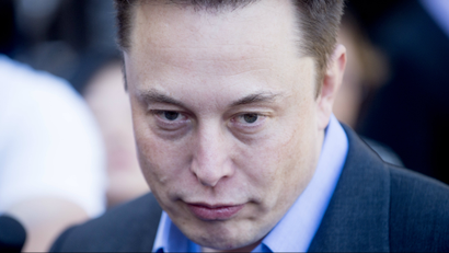 Tesla CEO Elon Musk speaks with members of the media at Tesla's headquarters in Palo Alto, Calif., Thursday, April 30, 2015.