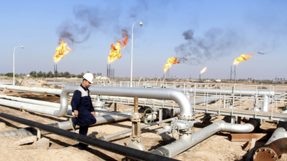 A worker walks at Nahr Bin Umar oil field, north of Basra, Iraq.