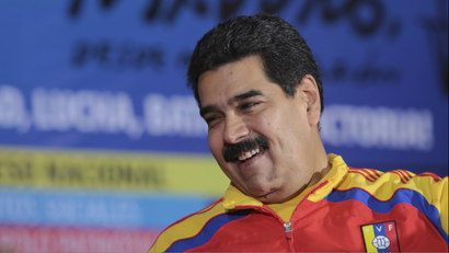 Venezuela's President Nicolas Maduro smiles during a meeting with the political alliance Gran Polo Patriotico (Great Patriotic Pole) in Caracas in this November 8, 2014 photo.