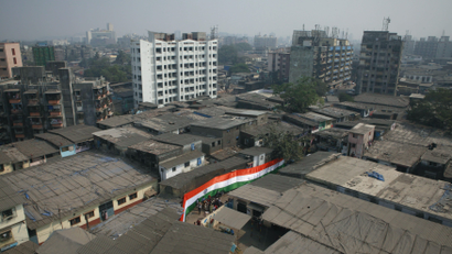 A Indian national flag is pictured in a street in Dharavi one of Asia's largest slums in Mumbai
