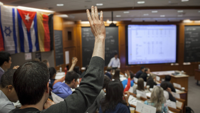 An HBS student raises his hand
