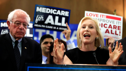Sen. Kirsten Gillibrand, D-N.Y. with Sen. Bernie Sanders, I-Vt., speaks at a gathering introducing the Medicare for All Act of 2019, on Capitol Hill in Washington, Wednesday, April 10, 2019.