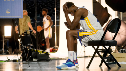 Sep 27, 2021; San Francisco, CA, USA; Golden State Warriors forward Andrew Wiggins (22) looks at his phone during Media Day at the Chase Center.