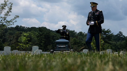 US Army Chaplain Adams departs after leading a burial service for World War II veteran Mann at Arlington National Cemetery in June 2019.