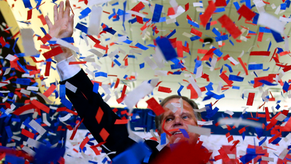 Democratic candidate for U.S. Senate Doug Jones waves as confetti falls before speaking during an election-night watch party Tuesday, Dec. 12, 2017, in Birmingham, Ala. Jones is facing Republican Roy Moore.