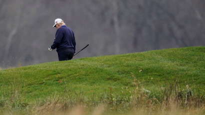 U.S. President Donald Trump plays golf at the Trump National Golf Club in Sterling, Virginia
