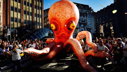 Inflatable octopus at a parade.