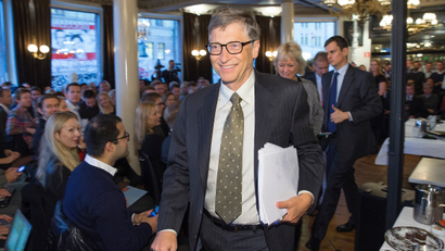 Bill Gates leaves after speaking at a breakfast meeting in Oslo