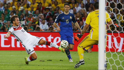 Germany's Mario Goetze shoots to score a goal past Argentina's goalkeeper Sergio Romero world cup final.