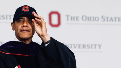 Barack Obama dons an Ohio State University cap