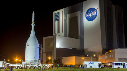 The Orion capsule is moved at Kennedy Space Center in Florida November 11, 2014. The NASA spacecraft designed to one day fly astronauts to Mars rolled out of its processing hangar at the U.S. space agency's Kennedy Space Center in Florida on Thursday to be prepared for a debut test flight in December.