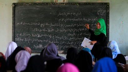 A teacher teaches Arabic language to Muslim students inside a classroom at Al-Markazie islamic institute in Balo-i town, Lanao Del Norte, southern Philippines, September 9, 2017. Picture taken September 9, 2017.