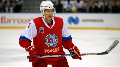 Vladimir Putin playing hockey