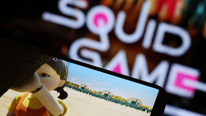 A Netflix viewer watches Squid Game on a tablet