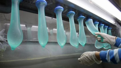 Condoms being tested at the Karex condom factory in Pontian, Malaysia