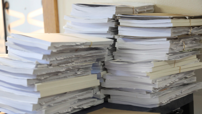 A stack of voter signature books