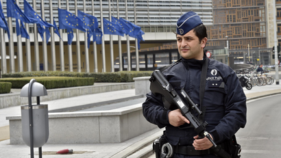 Police patrol the EU commission building.
