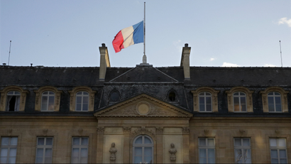 The French flag flies at half-mast above the Elysee Palace in a sign of mourning in Paris January 8, 2015 the day after a shooting at the Paris offices of weekly satirical newspaper Charlie Hebdo.