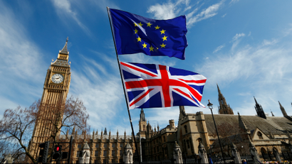 EU and UK flags over British parliament