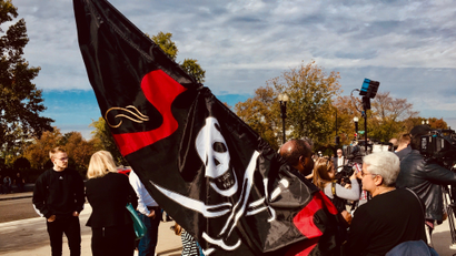 Supporters of Frederick Allen wave pirate flag at SCOTUS.