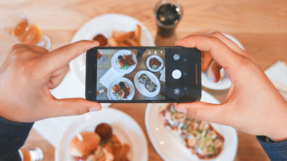 smartphone taking pictures of food