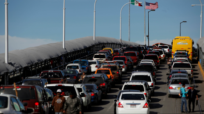 Cars wait to cross US-Mexico border