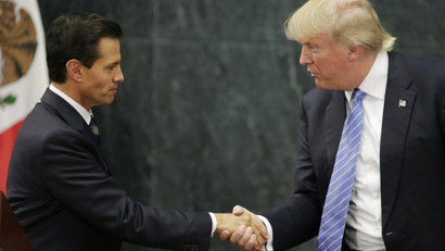 U.S. Republican presidential nominee Donald Trump and Mexico's President Enrique Pena Nieto shake hands.