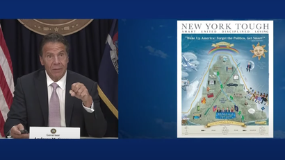 Andrew Cuomo unveils his pandemic-themed poster to the press
