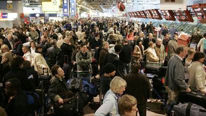 Passengers queue in Terminal 4 at Heathrow airport in west London.