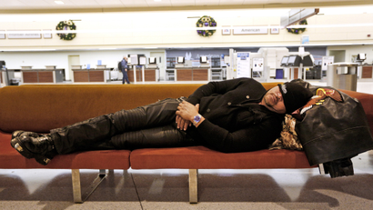 guy sleeping in airport