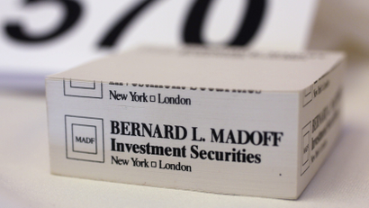 A "stickies" pad embossed with the investment firm of convicted Ponzi schemer Bernard Madoff is auctioned in Florida in 2011.